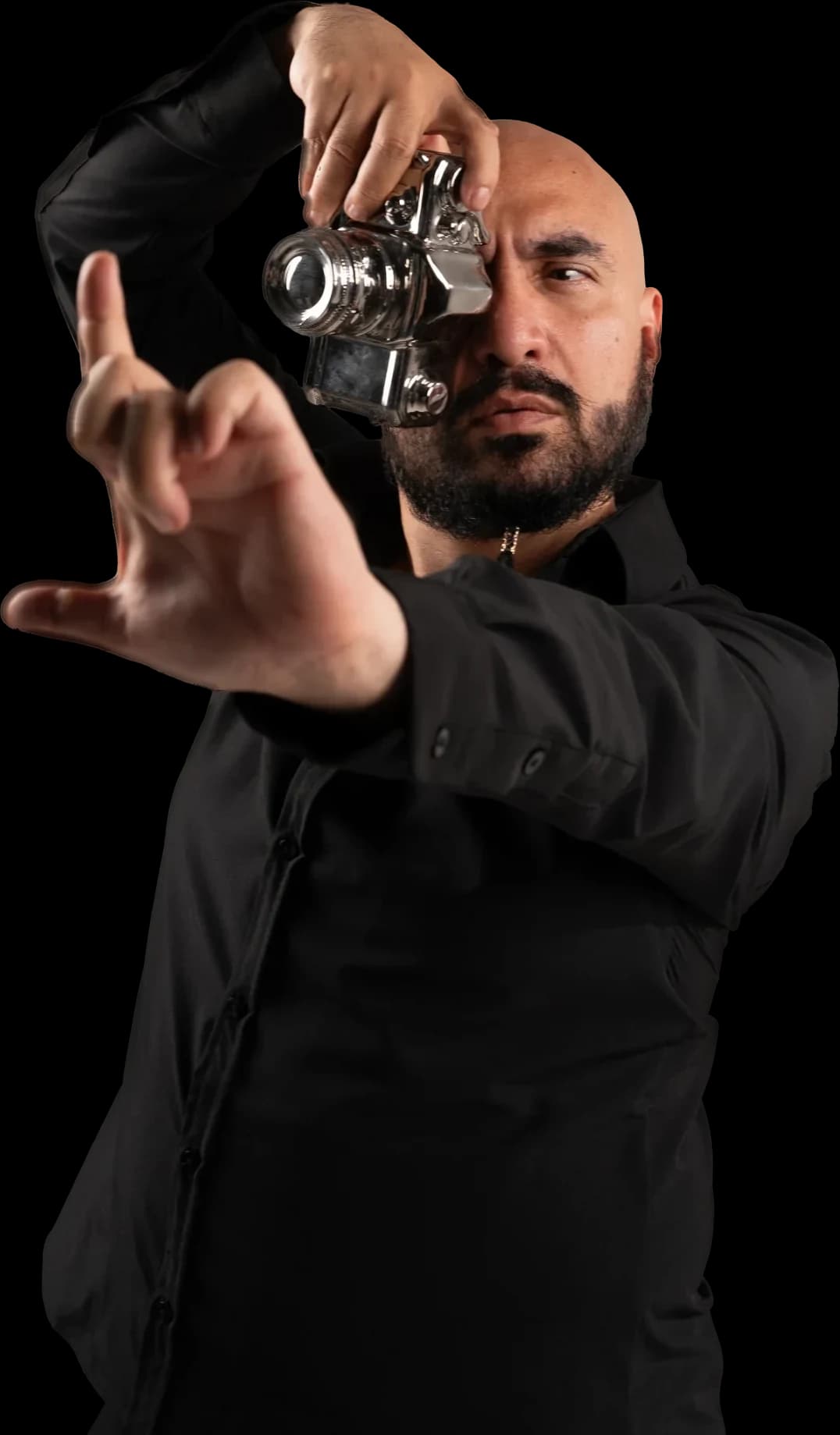 Andrés Franco framing a shot with a camera